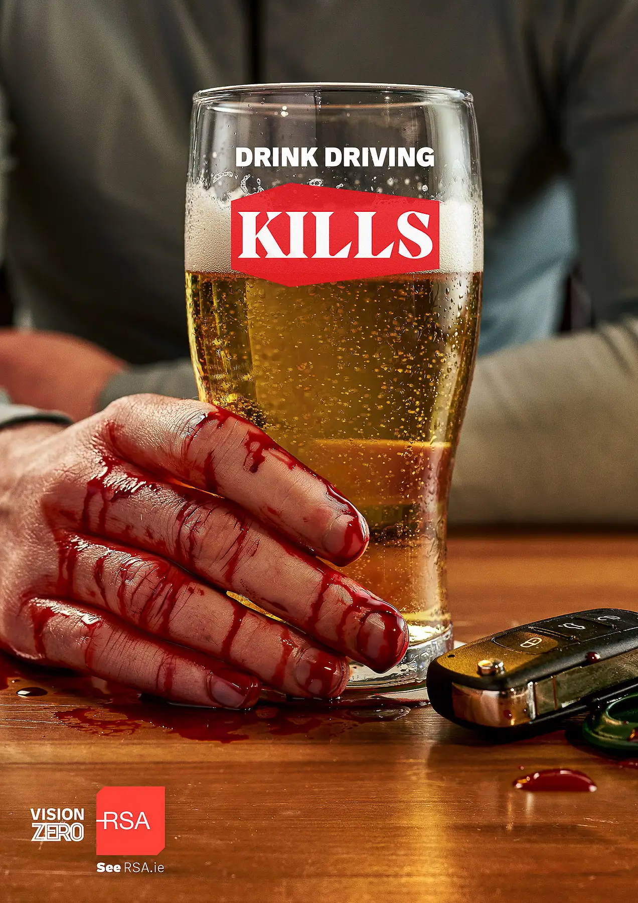 RSA anti drink driving campaign pint glass raised in atmospheric pub lighting