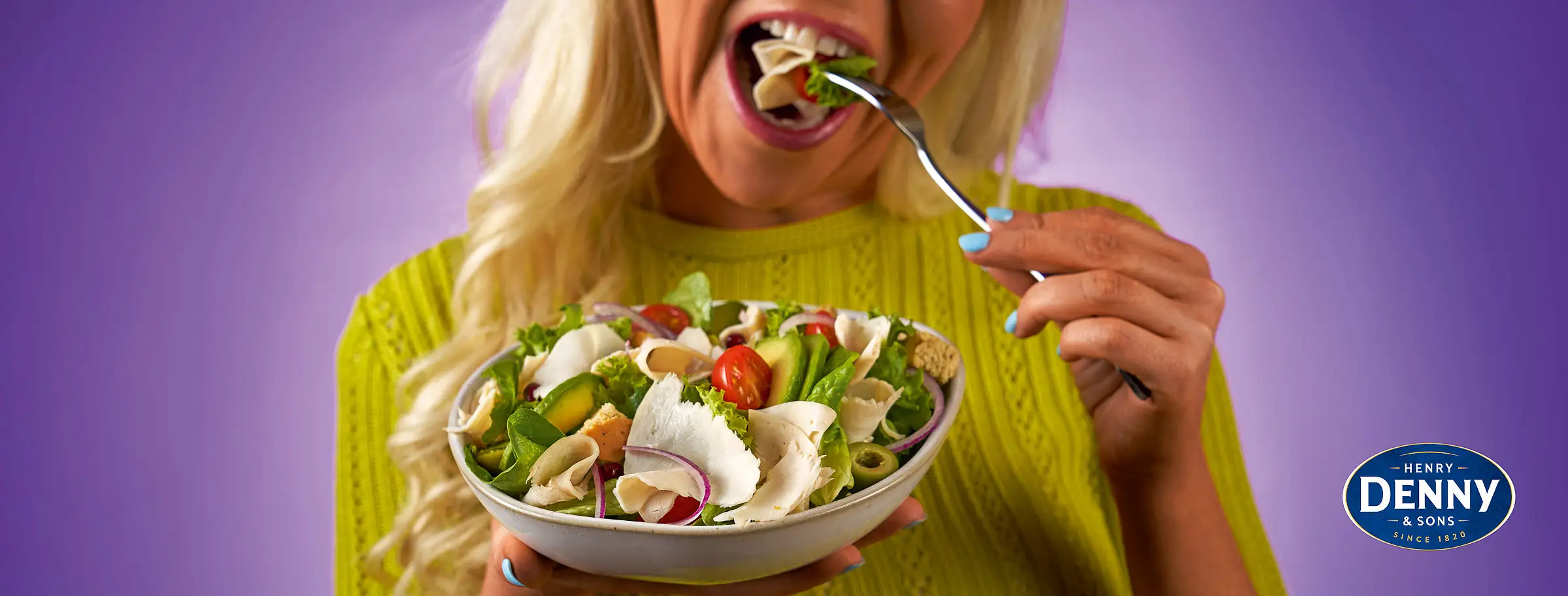 Denny chicken salad plated with vibrant greens and artisan bread