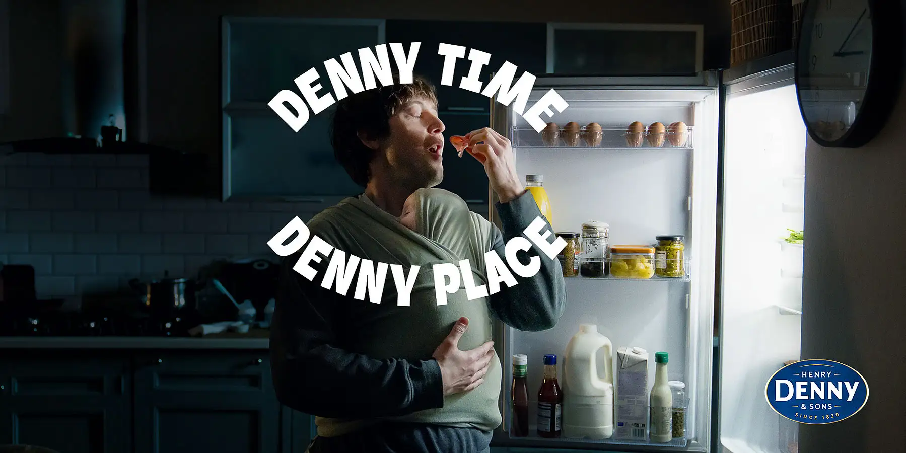 Baby reaching into fridge stocked with Denny breakfast favourites