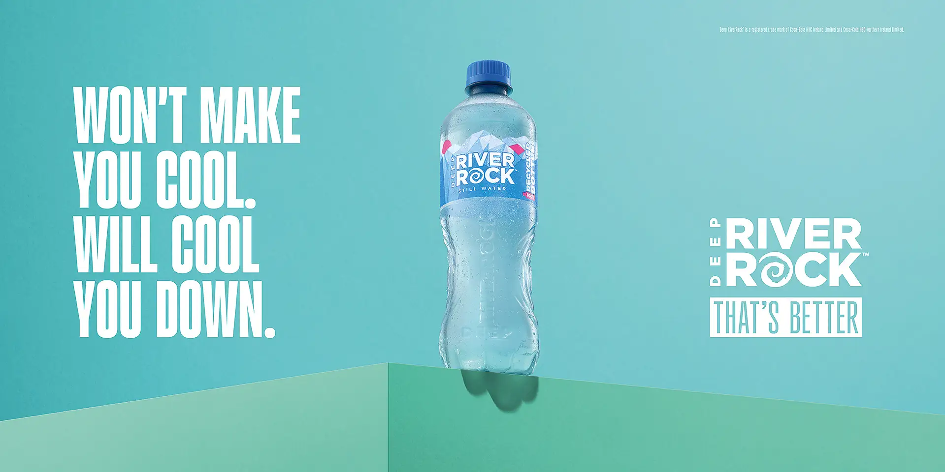 River Rock 500ml water bottle with cascading droplets on basalt rock