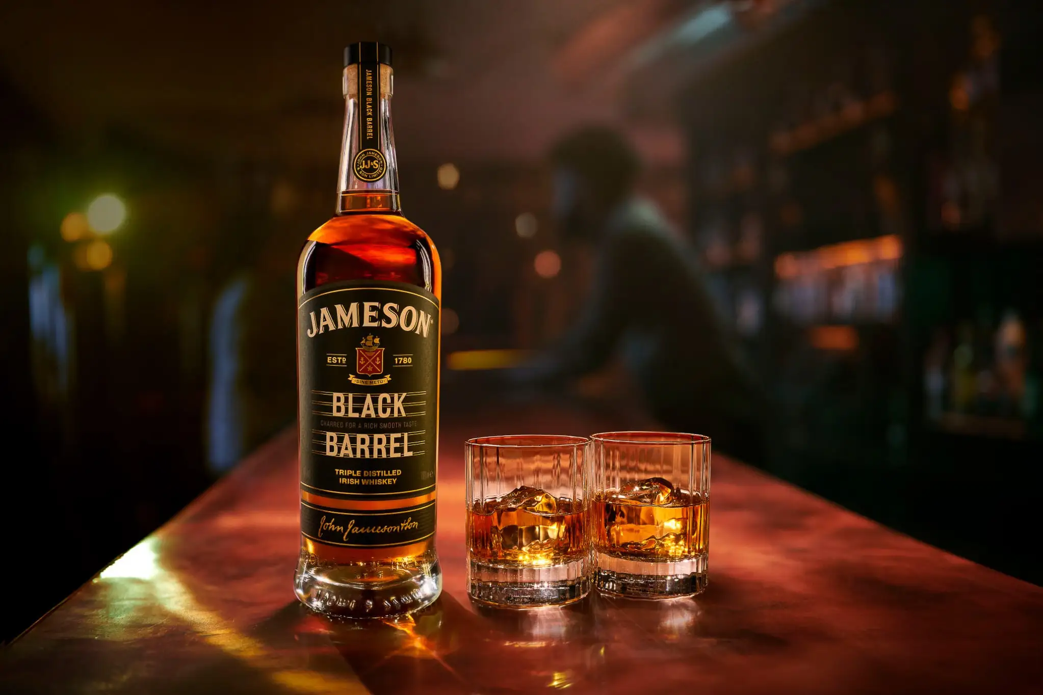 Jameson Black Barrel cocktail on NYC rooftop at golden hour