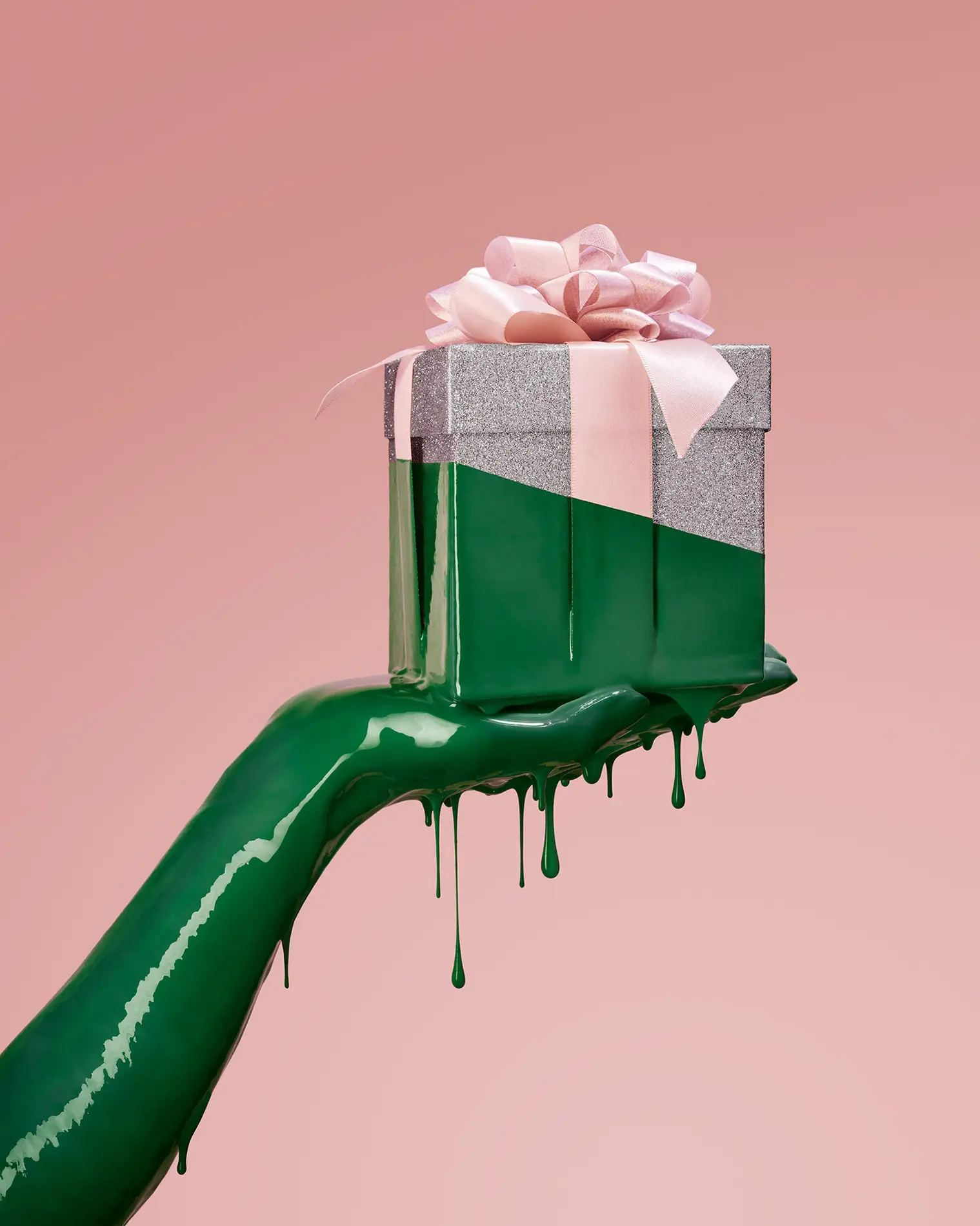 Hand presenting Champion Green Green Friday gift tag on emerald backdrop