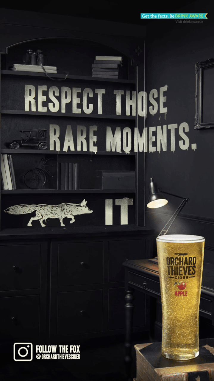 Friends sharing Orchard Thieves cider during twilight rooftop gathering