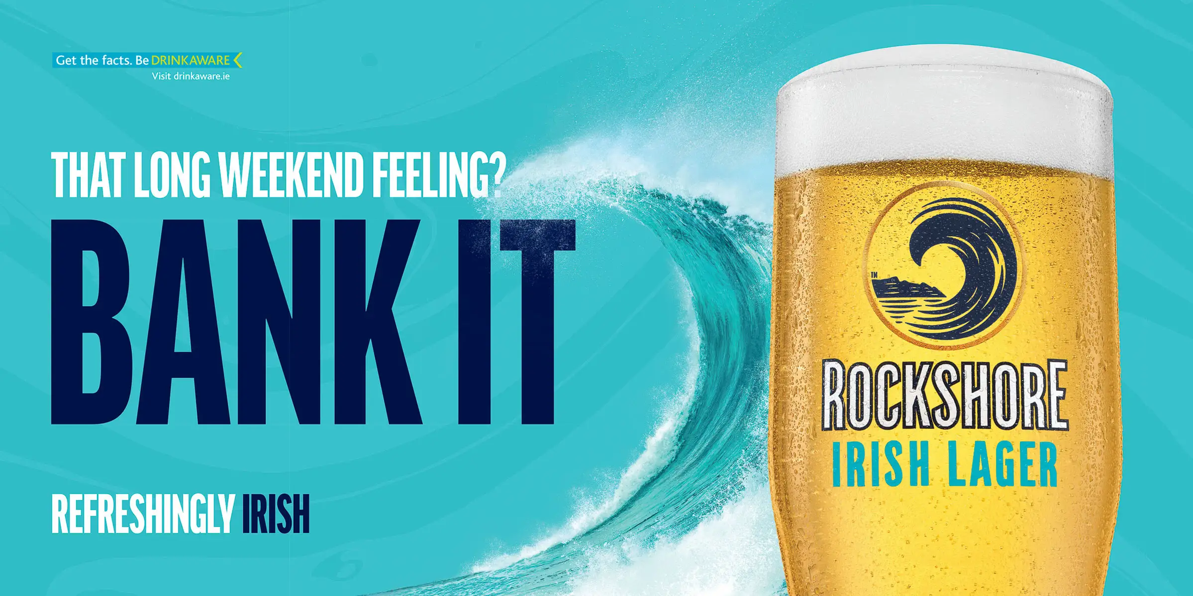 Rockshore lager can facing Atlantic wave spray on rocky shore