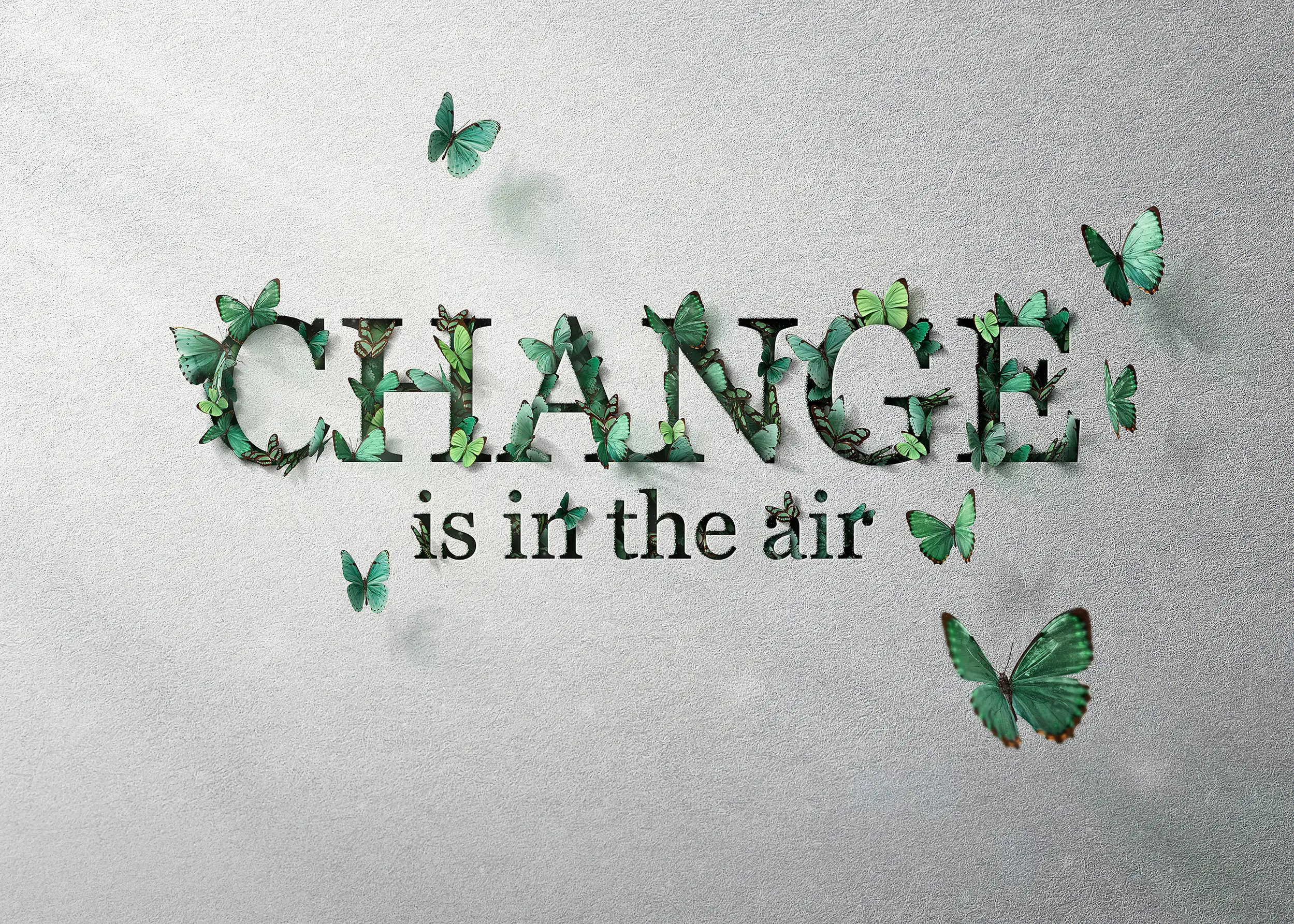 Champion Green shopper holding 'Change is in the Bag' tote against emerald wall